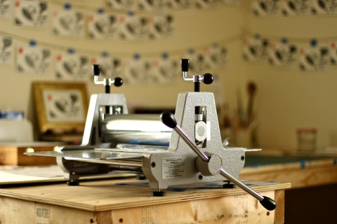 My printing press (dubbed The Little Workhorse) and walls filled with drying prints.